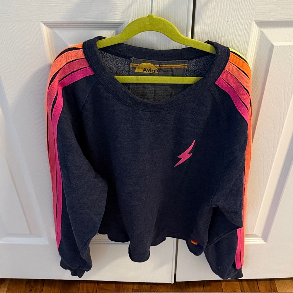 Aviator Nation cropped Sweatshirt with Vibrant fluorescent Stripes down arms.